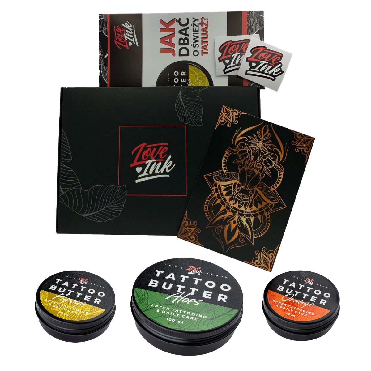 A collection of Love Ink tattoo care products displayed on a transparent background. The items include a black box with the Love Ink logo, a brochure on how to care for a new tattoo, a sticker, a black and gold tattoo design, and three tins of Tattoo Butter in different formulations for daily care.