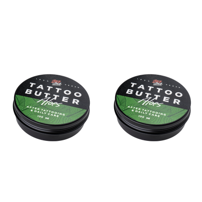 Two tins of Love Ink Tattoo Butter on a transparent background. Both tins are labeled 'Aloe' with a green design